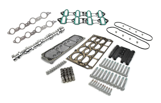 Various mechanical and plastic components arranged on a white surface.