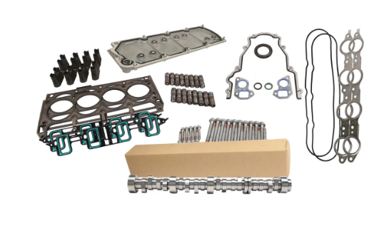 A collection of engine parts and gaskets laid out on a white background.