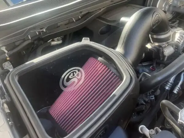 Car engine with aftermarket air intake system.