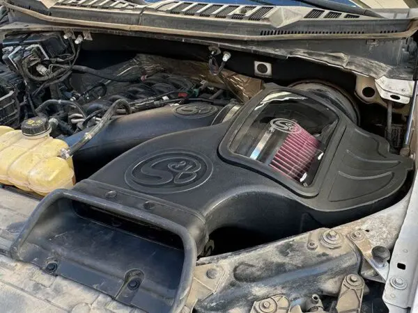 Truck engine with custom air intake system.