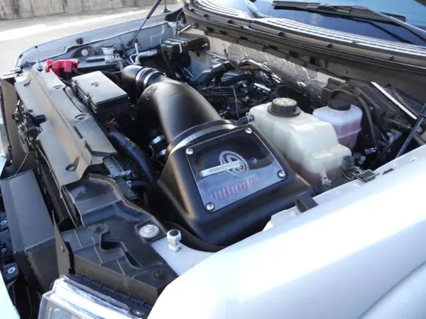 Car engine with performance air intake system.