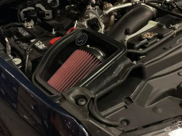 Car engine with performance air intake system.