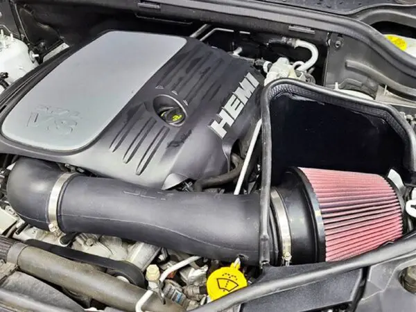 Car engine with HEMI V8 logo.